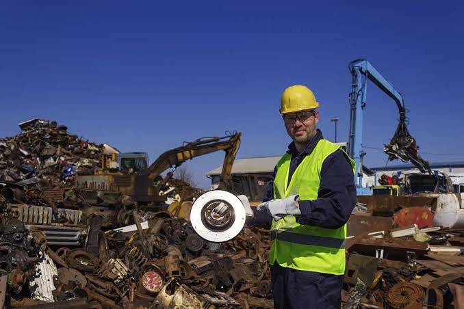 Trading team reviewing material specifications on site at a scrapyard